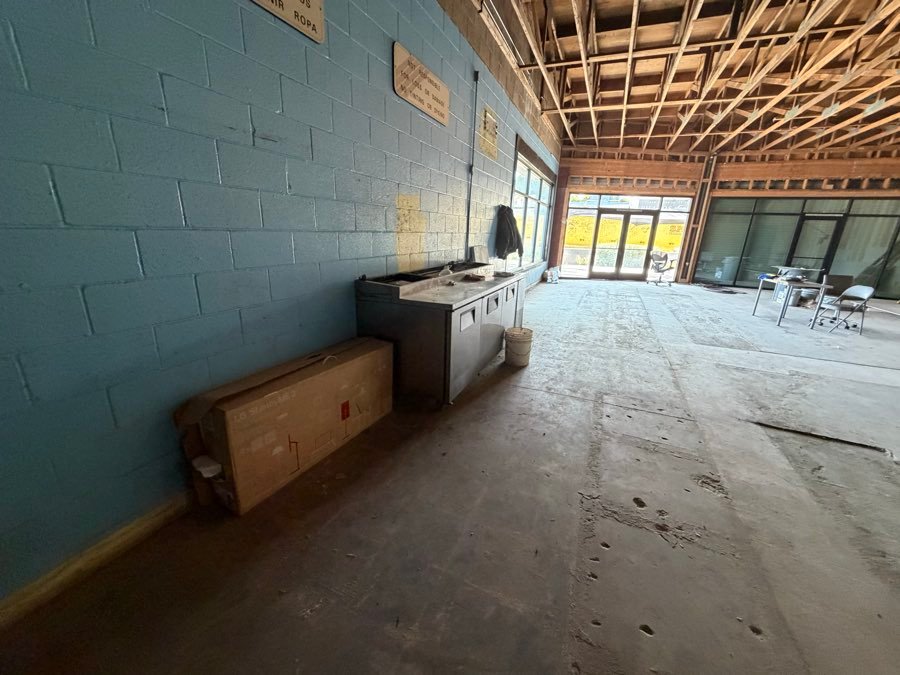 Before â€” Commercial unit â€” fixtures pulled and swept
